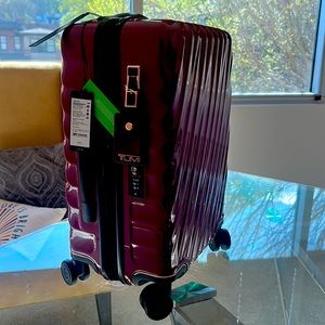 Tumi NWT 21” carry on. - burgundy with rose gold & usb charger
